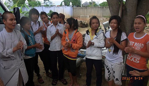 Minh and some of the children singing farewell