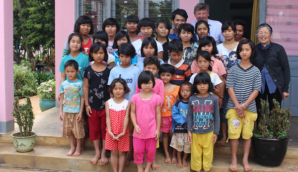 Sister Bernadette & Peter Fryers with the children.