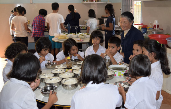 Sister Bernadette overseeing the girls having lunch
