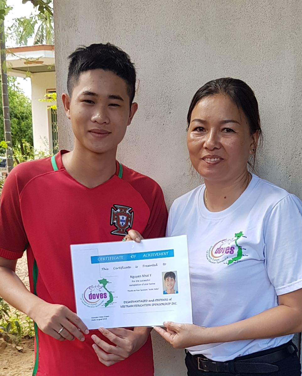 Huy recieving year 12 achievement award with Suong